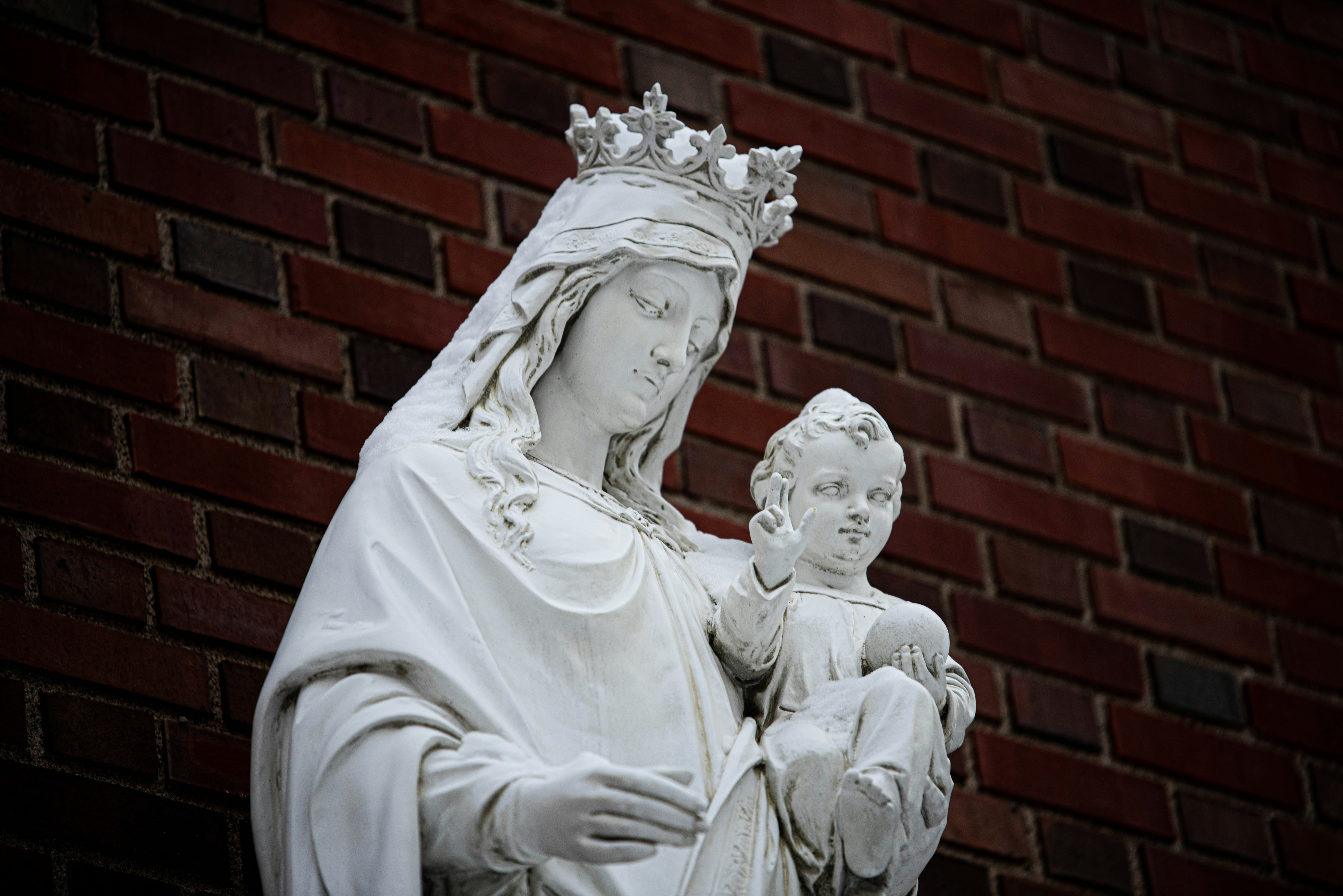 a statue of a woman holding a child