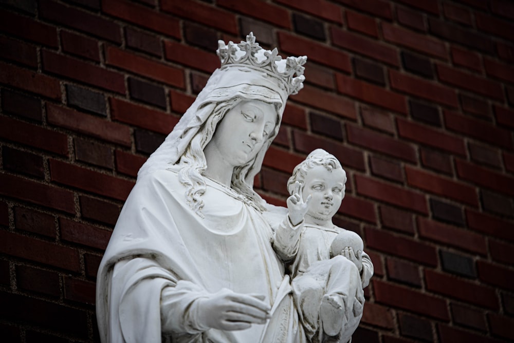 a statue of a woman holding a child