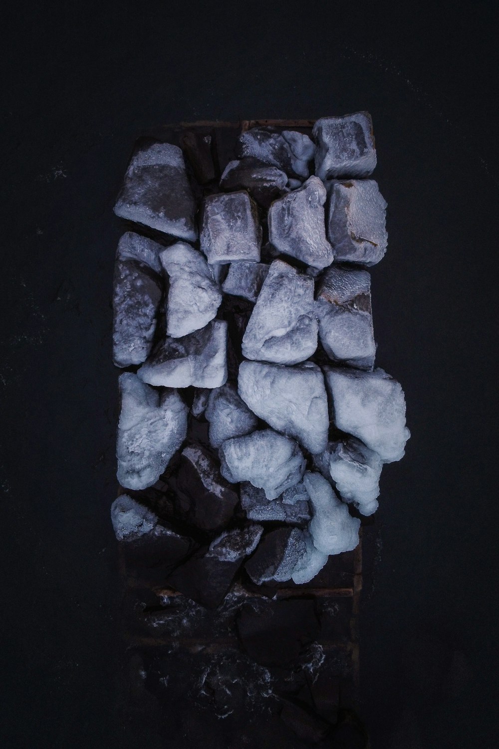 a pile of ice cubes sitting on top of a table