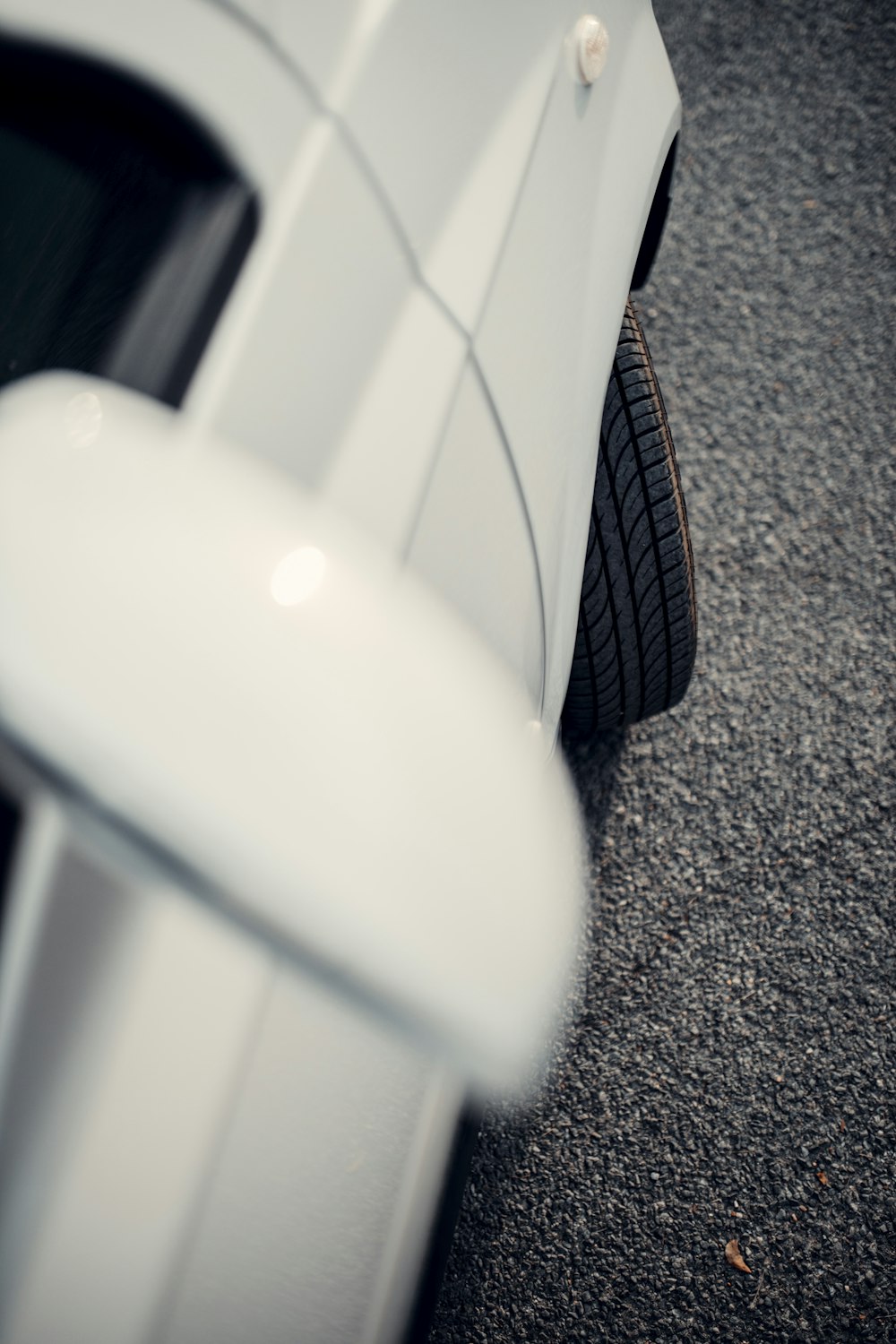 a white car parked on the side of the road