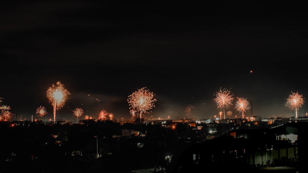 fireworks are lit up in the night sky