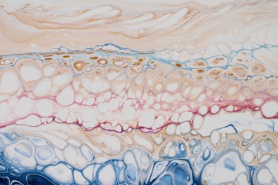 an abstract painting with blue, pink, and white colors