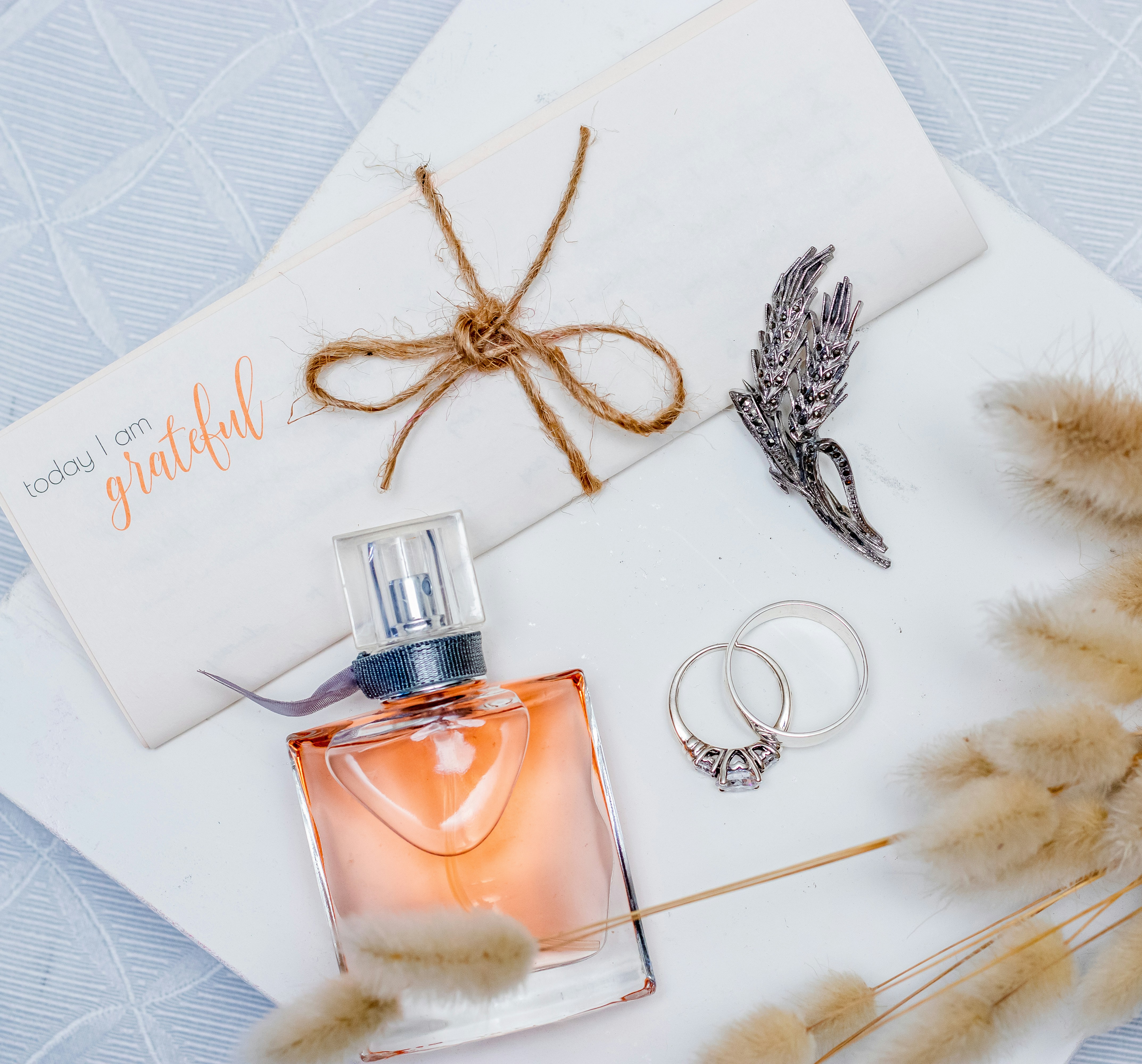 a bottle of perfume sitting on top of a table