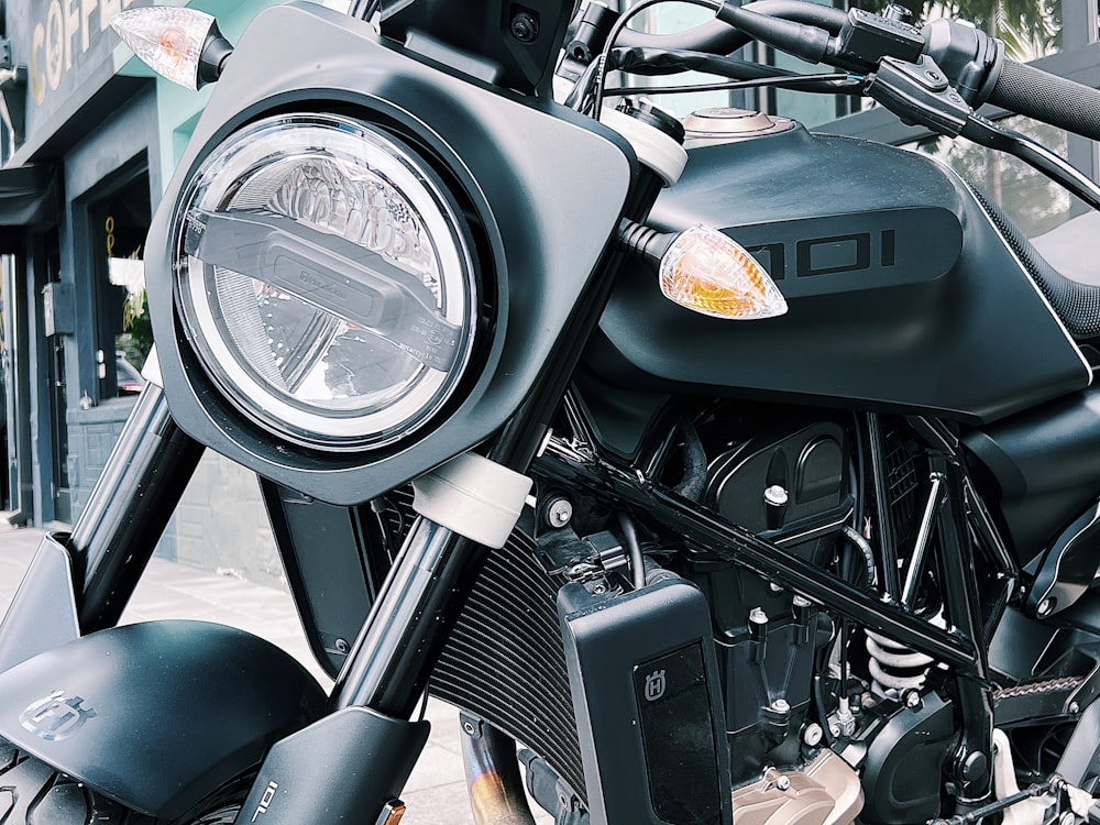 a close up of a motorcycle on a city street