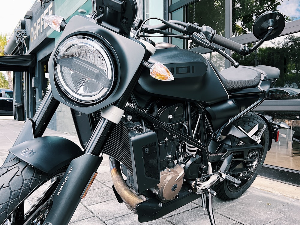 a close up of a motorcycle on a city street