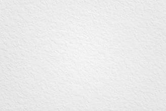 A clean, minimalistic white page with subtle structural outlines.