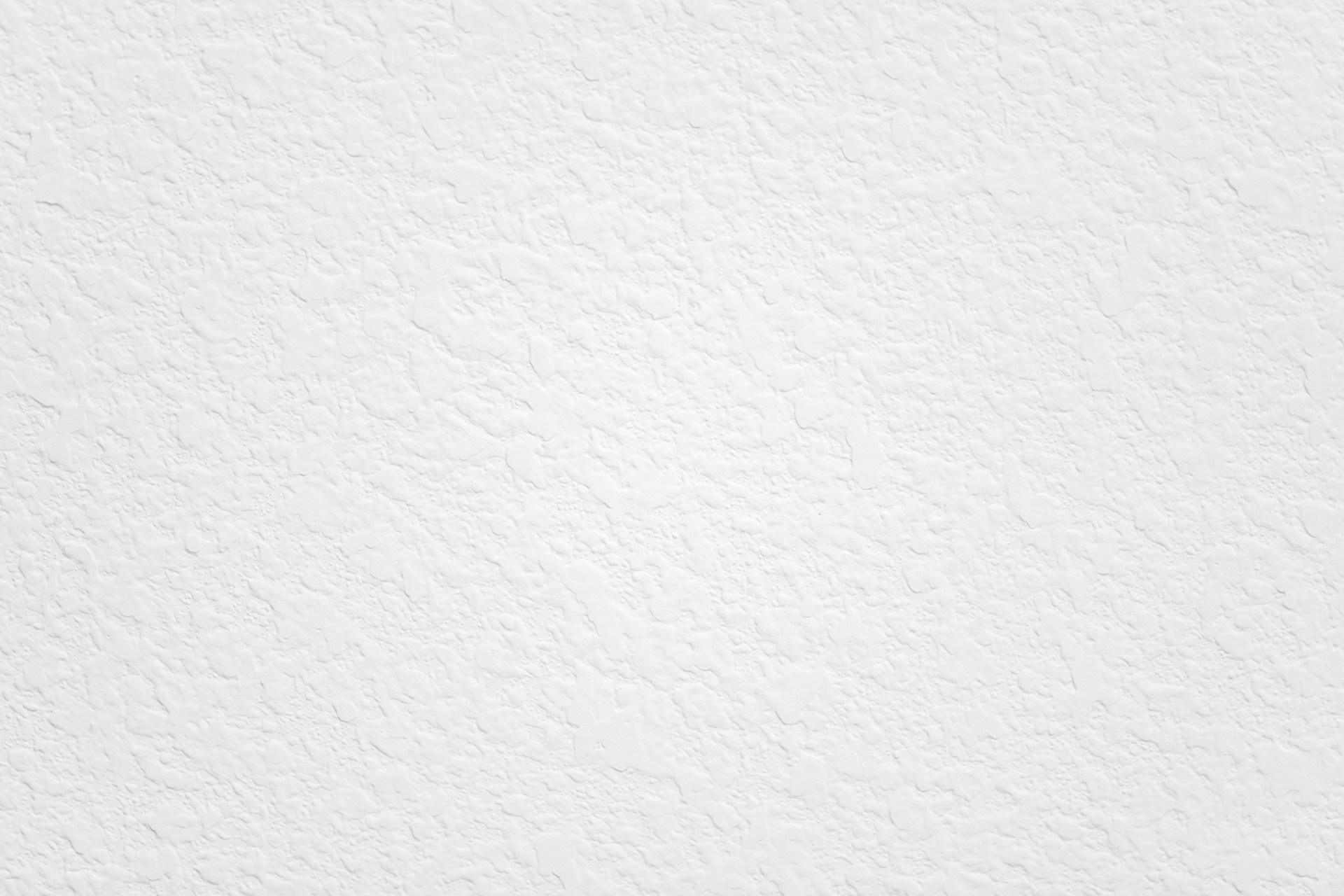 a black and white photo of a white wall