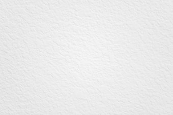 A textured white surface with uneven patterns and subtle variations in shading. The overall appearance is clean and minimalistic, with no distinct shapes or objects visible.