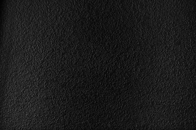 a black textured background with a white border