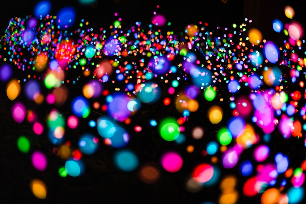 a lot of colorful lights that are in the dark