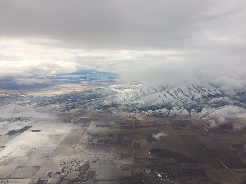 an aerial view of a snowy mountain range