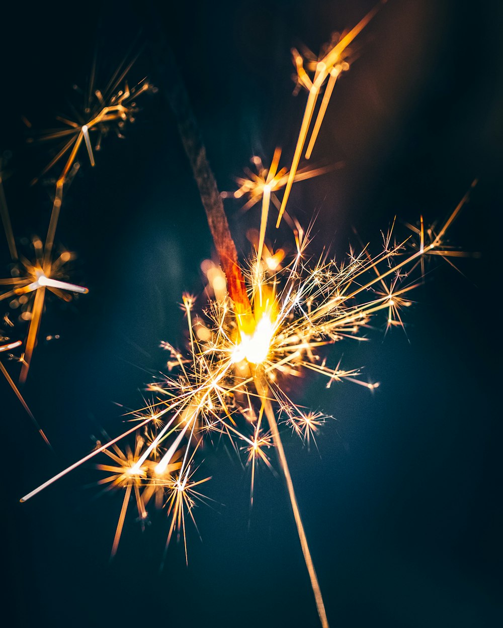 a close up of a sparkler on a black background