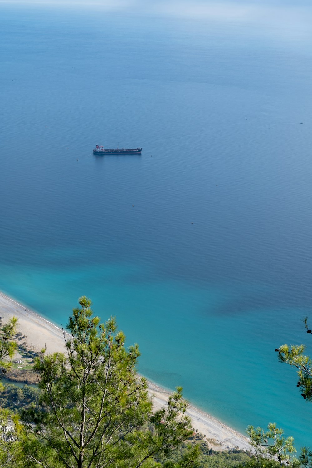 a boat floating on top of a large body of water