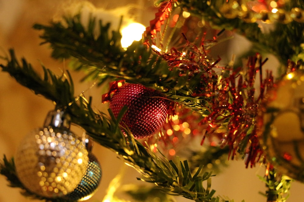 a close up of a christmas tree with ornaments