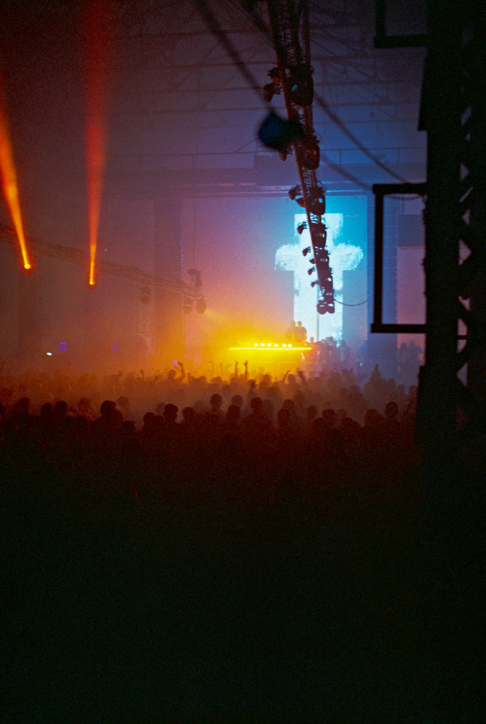 a crowd of people watching a concert on stage
