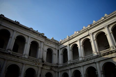 an old building with arches and arches on it