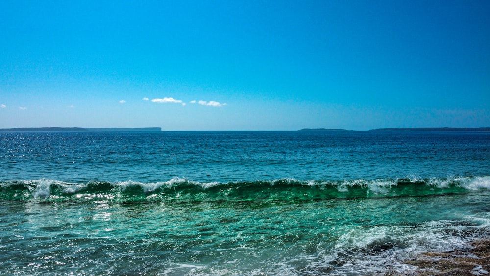 a body of water with a boat in the distance