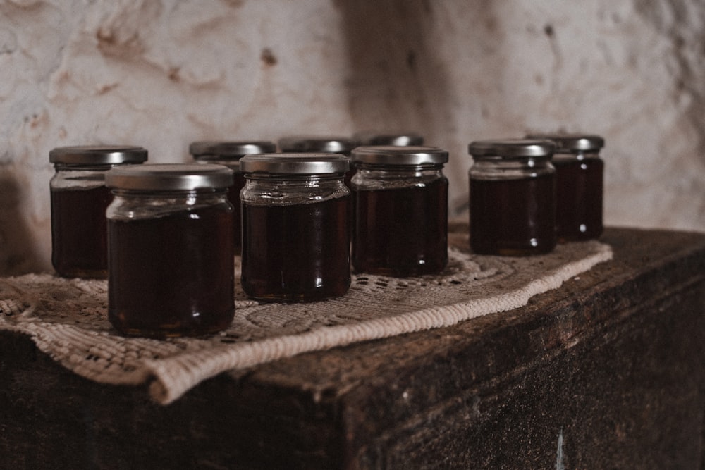 a bunch of jars that are sitting on a table