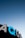 Large illuminated signage displaying the letters 'AQUA' against the backdrop of a clear gradient sky transitioning from deep blue to lighter blue near the horizon.