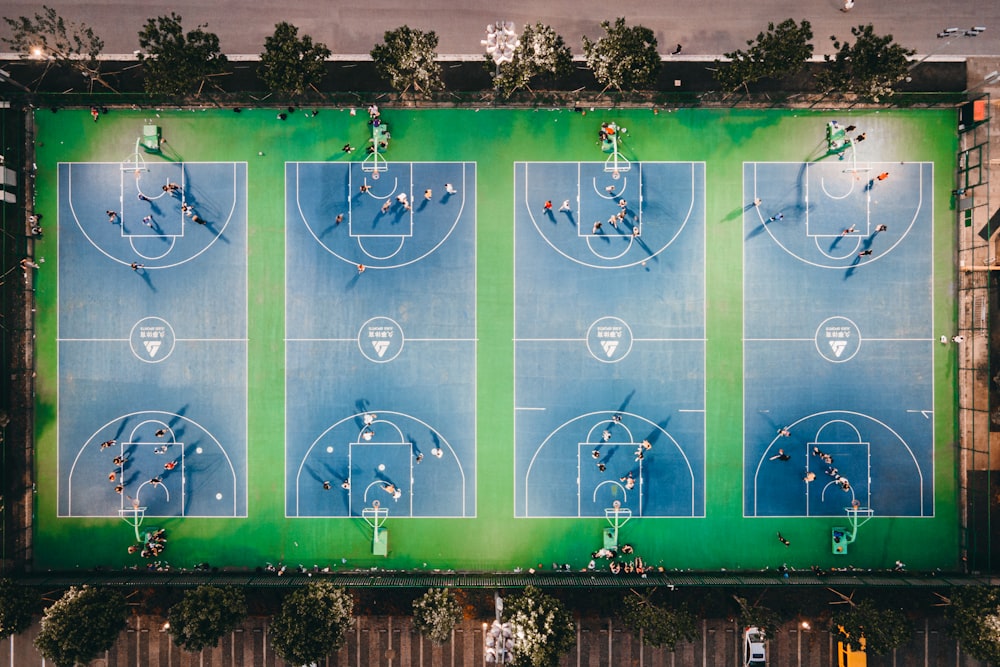 an overhead view of a basketball court with people playing