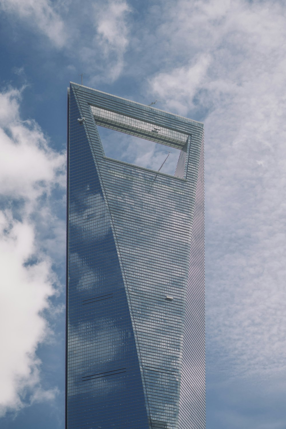 a very tall building with a sky background