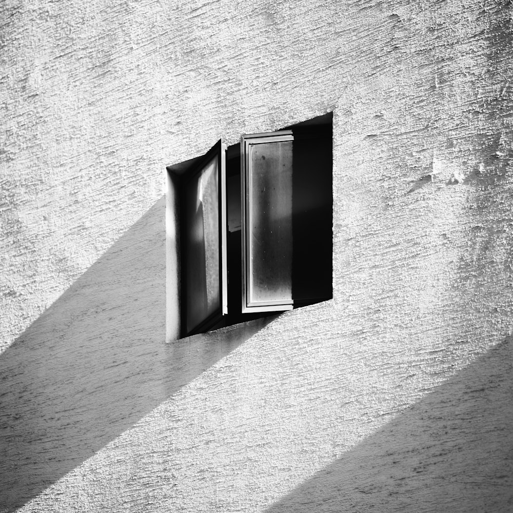 an open window on the side of a building