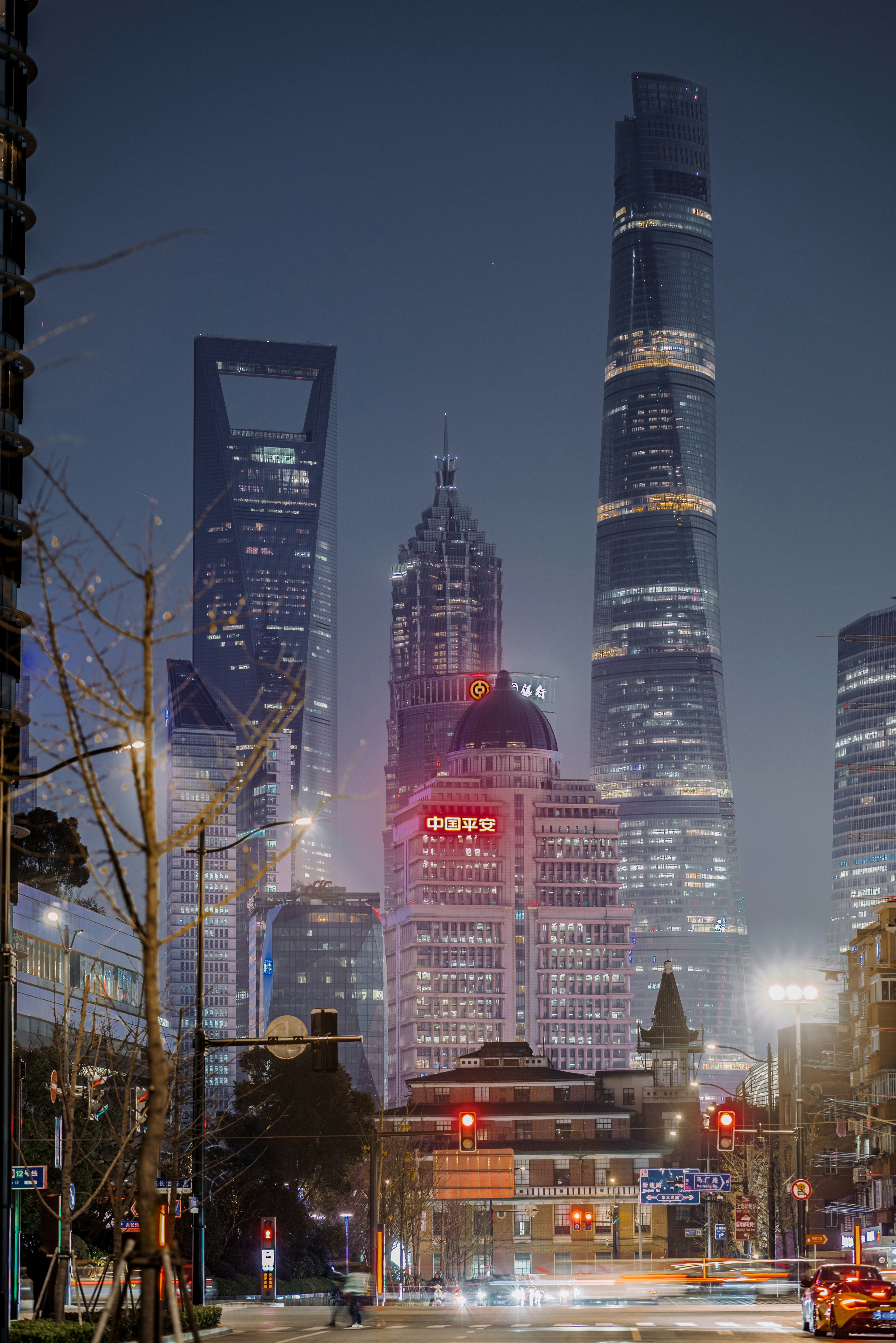 a city at night with a lot of tall buildings