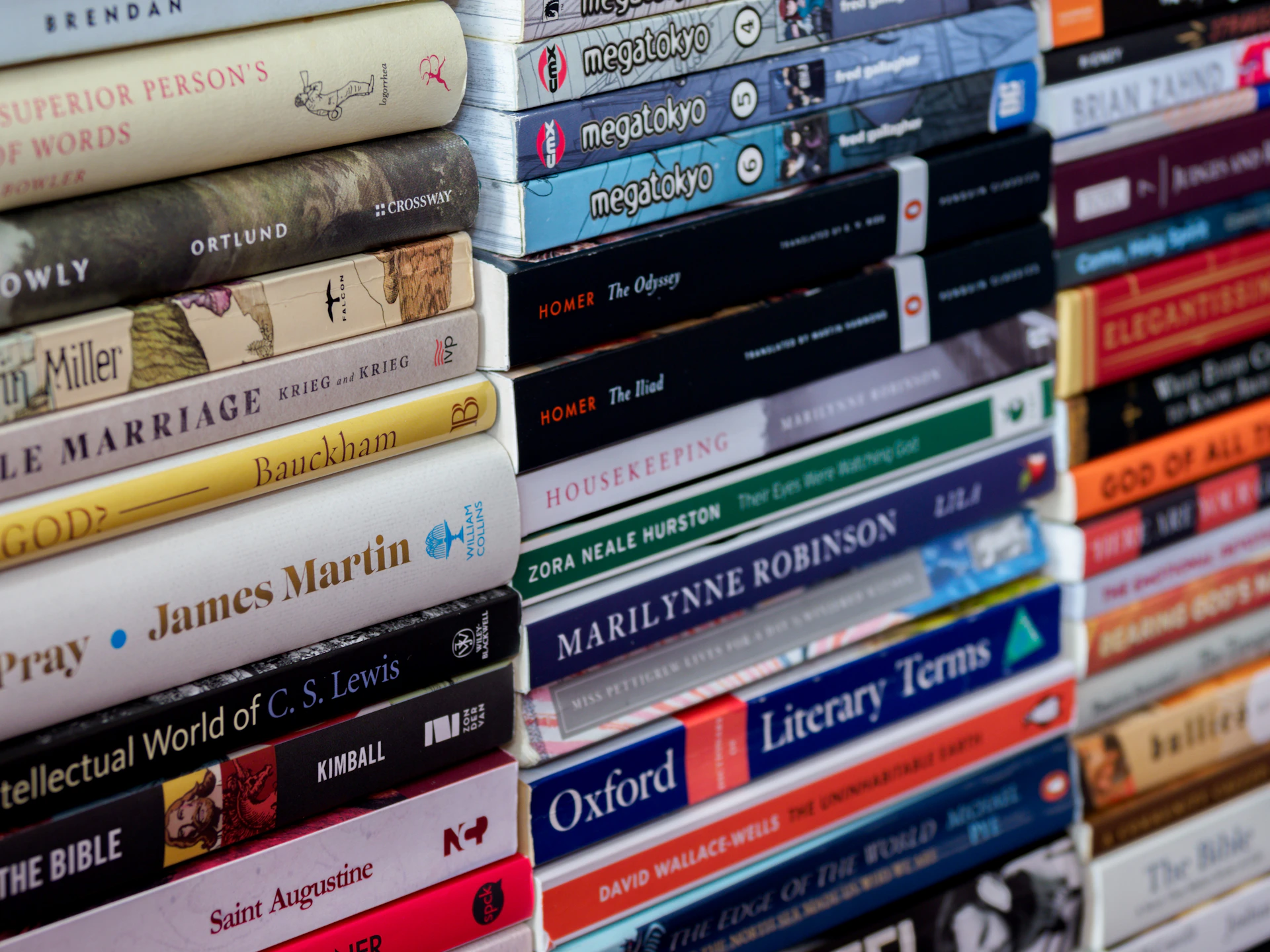 a stack of books sitting next to each other
