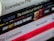 A close-up view of a staggered stack of books with varying titles and colors, some with bold or italicized text. The books appear to focus on religious or philosophical topics.