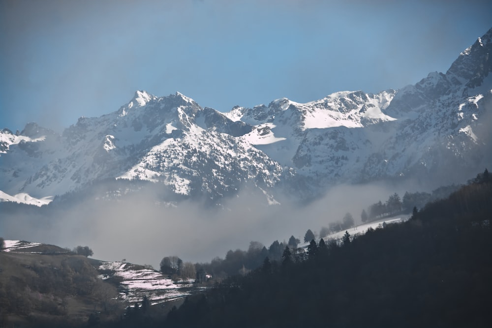 a view of a mountain range covered in snow