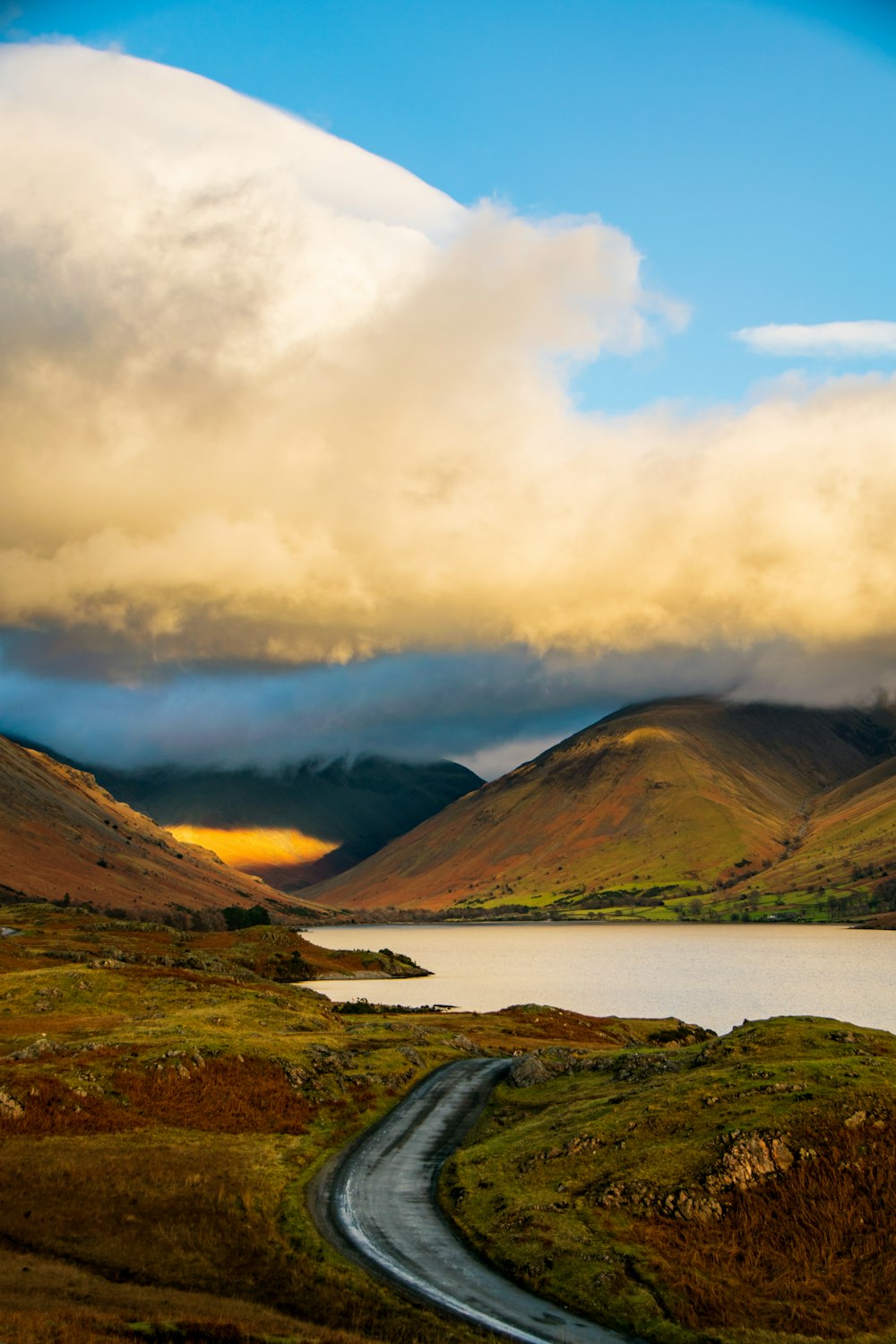 a scenic view of a lake and mountains