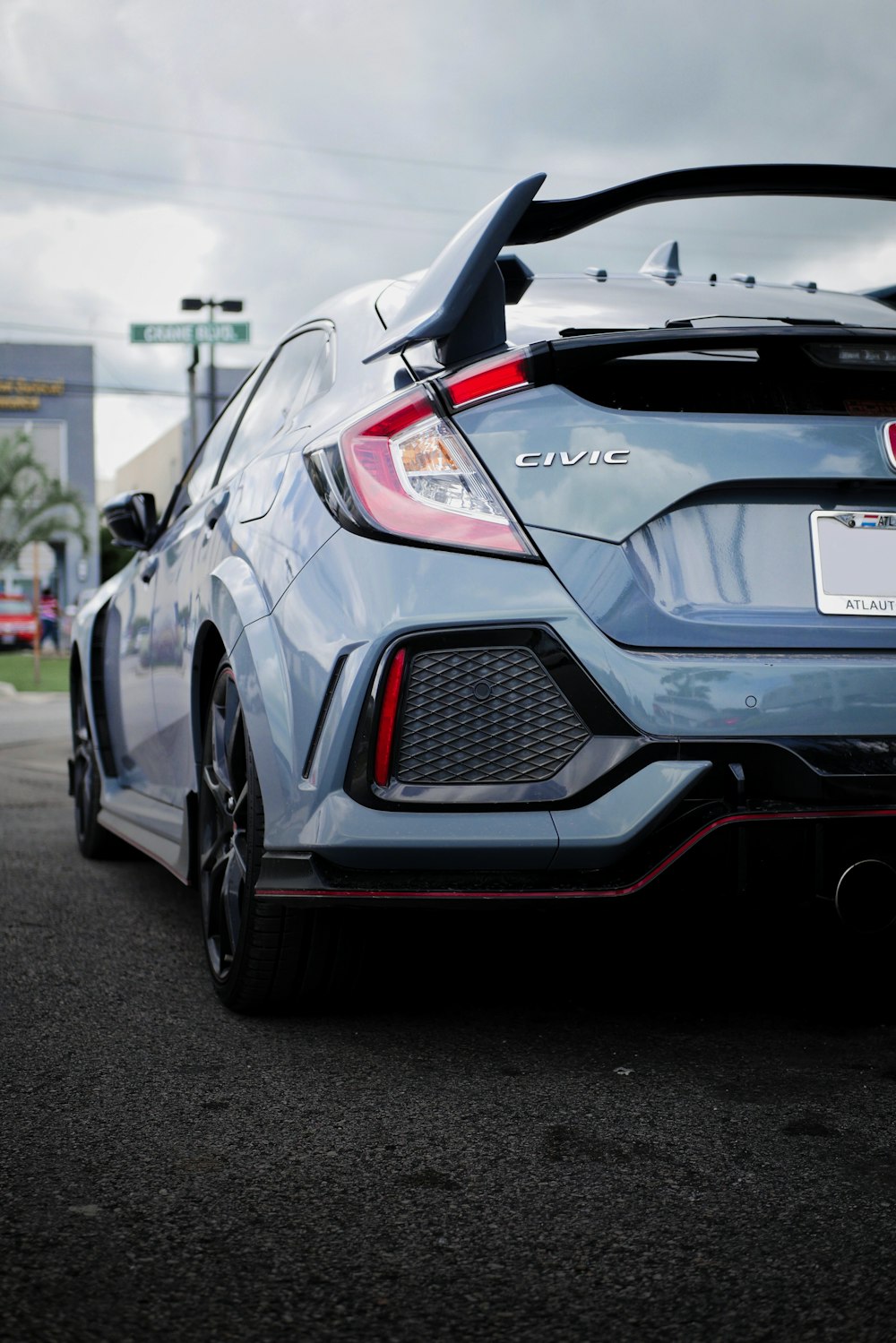 the rear end of a blue sports car