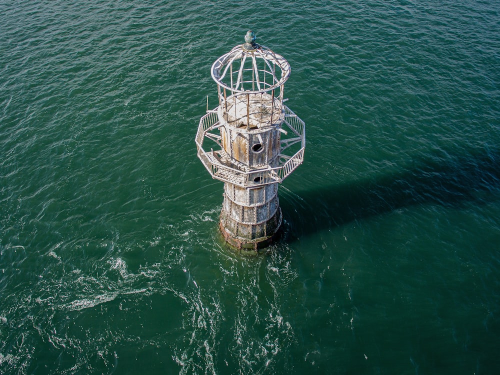 a tower in the middle of a body of water