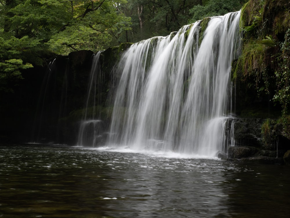 a large waterfall with lots of water coming out of it