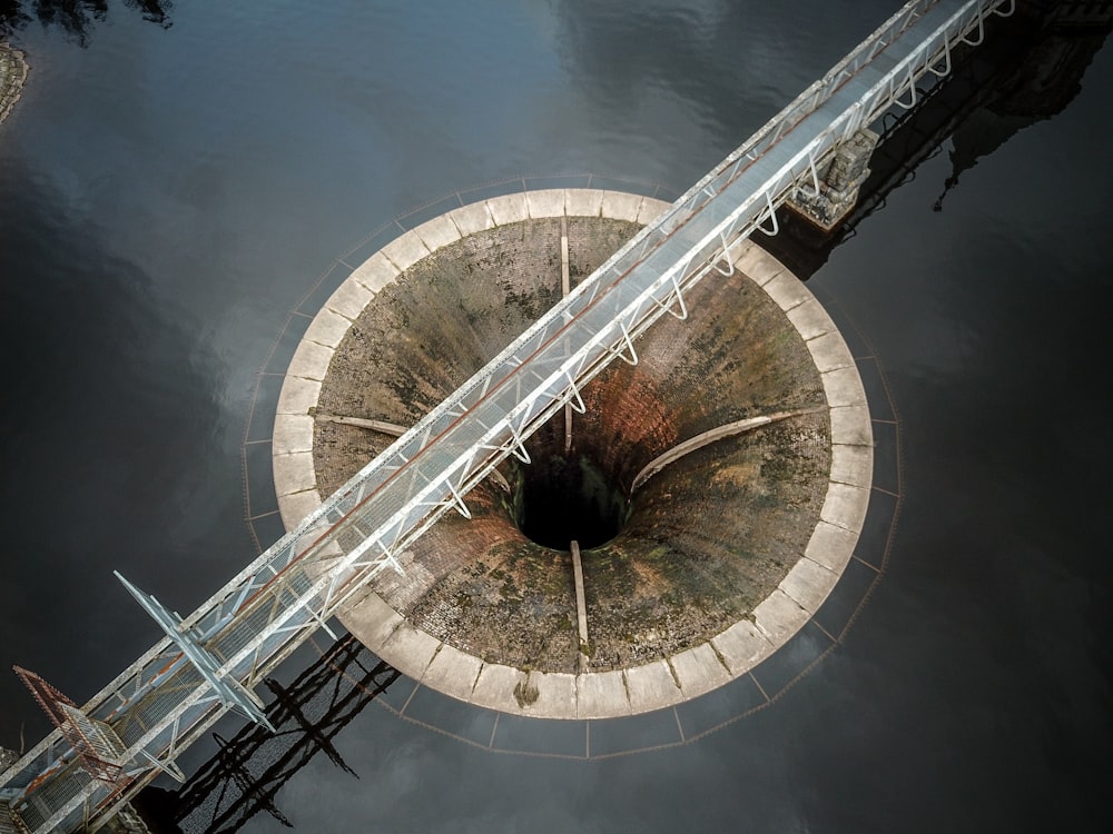 an aerial view of a concrete structure in the water