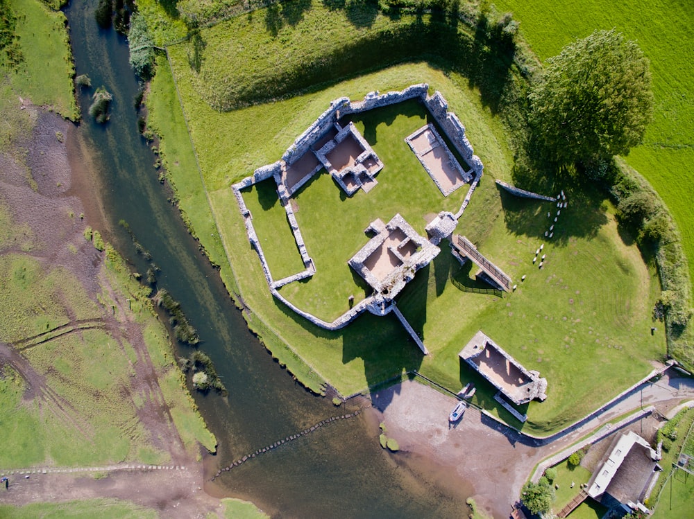 an aerial view of a castle with a river running through it