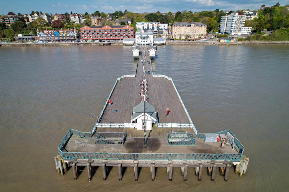 an aerial view of a pier on the water