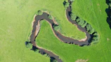 High-resolution aerial photograph of a winding river cutting through the East Midlands countryside.