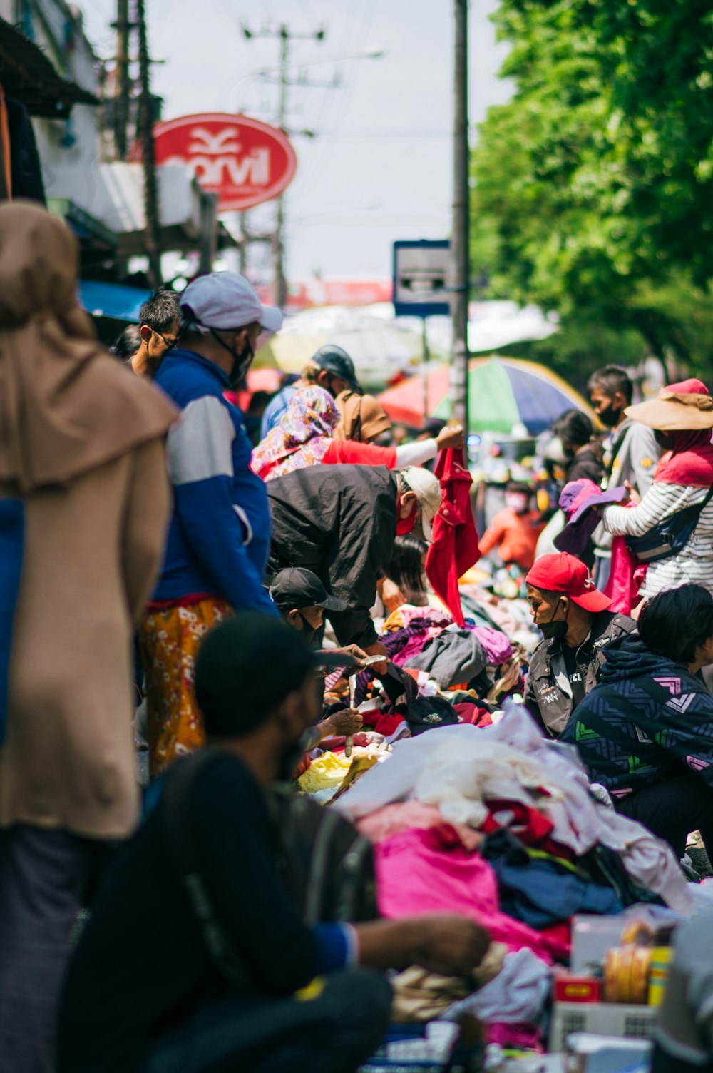 a group of people standing around a market