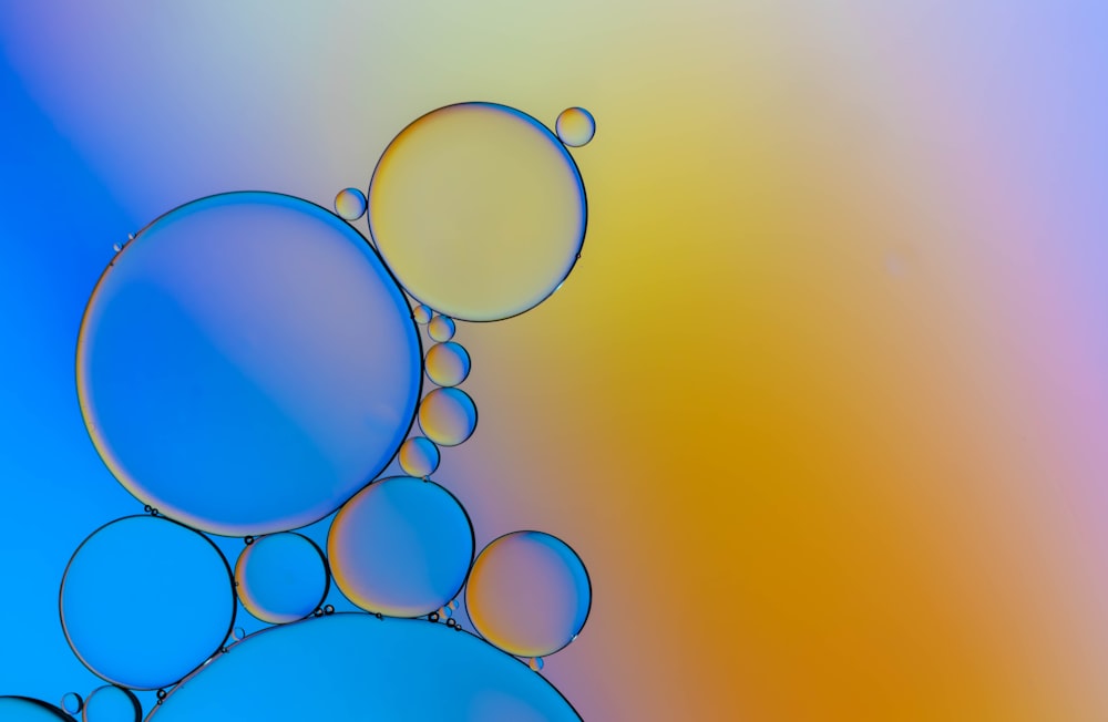 a multicolored background with bubbles of water