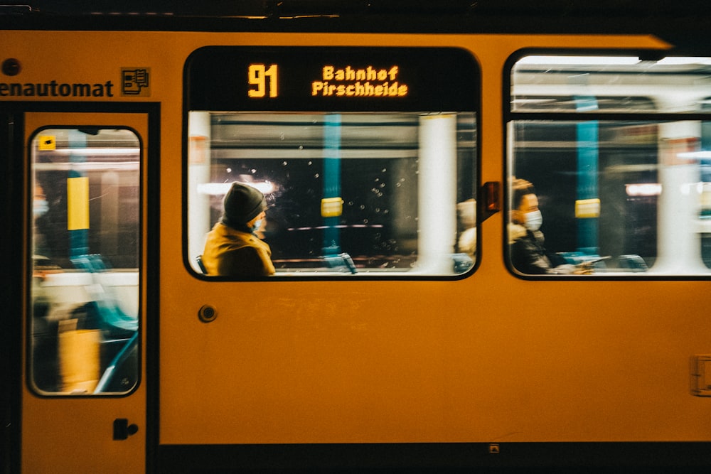 a person sitting on a bus at night