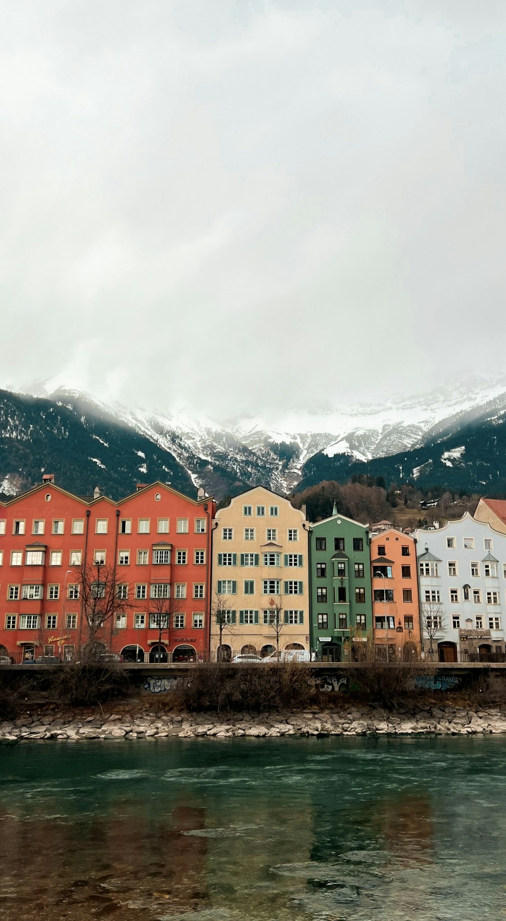 a group of buildings next to a body of water