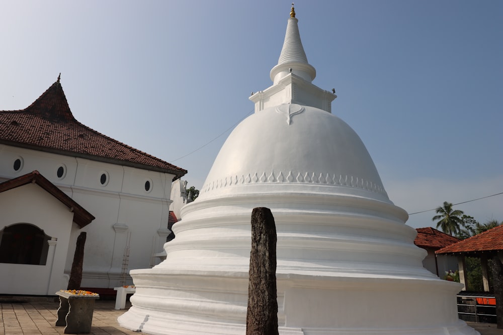 a large white building with a white roof