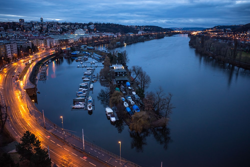 a harbor filled with lots of boats next to a city