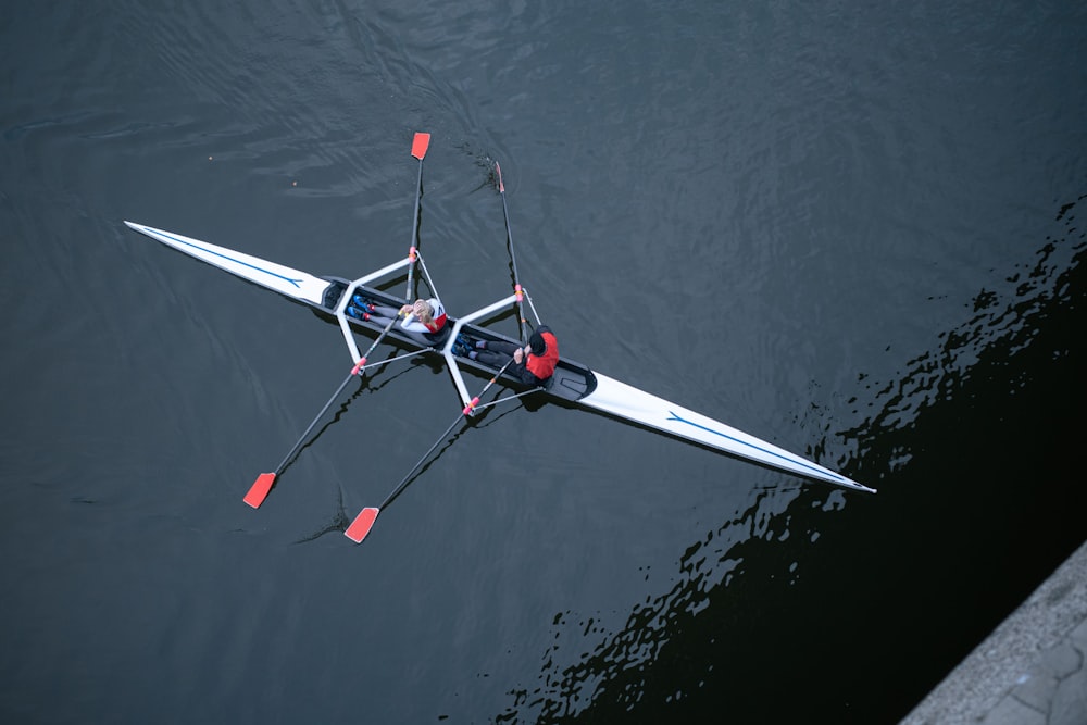 Image of two people rowing on a crew boat.