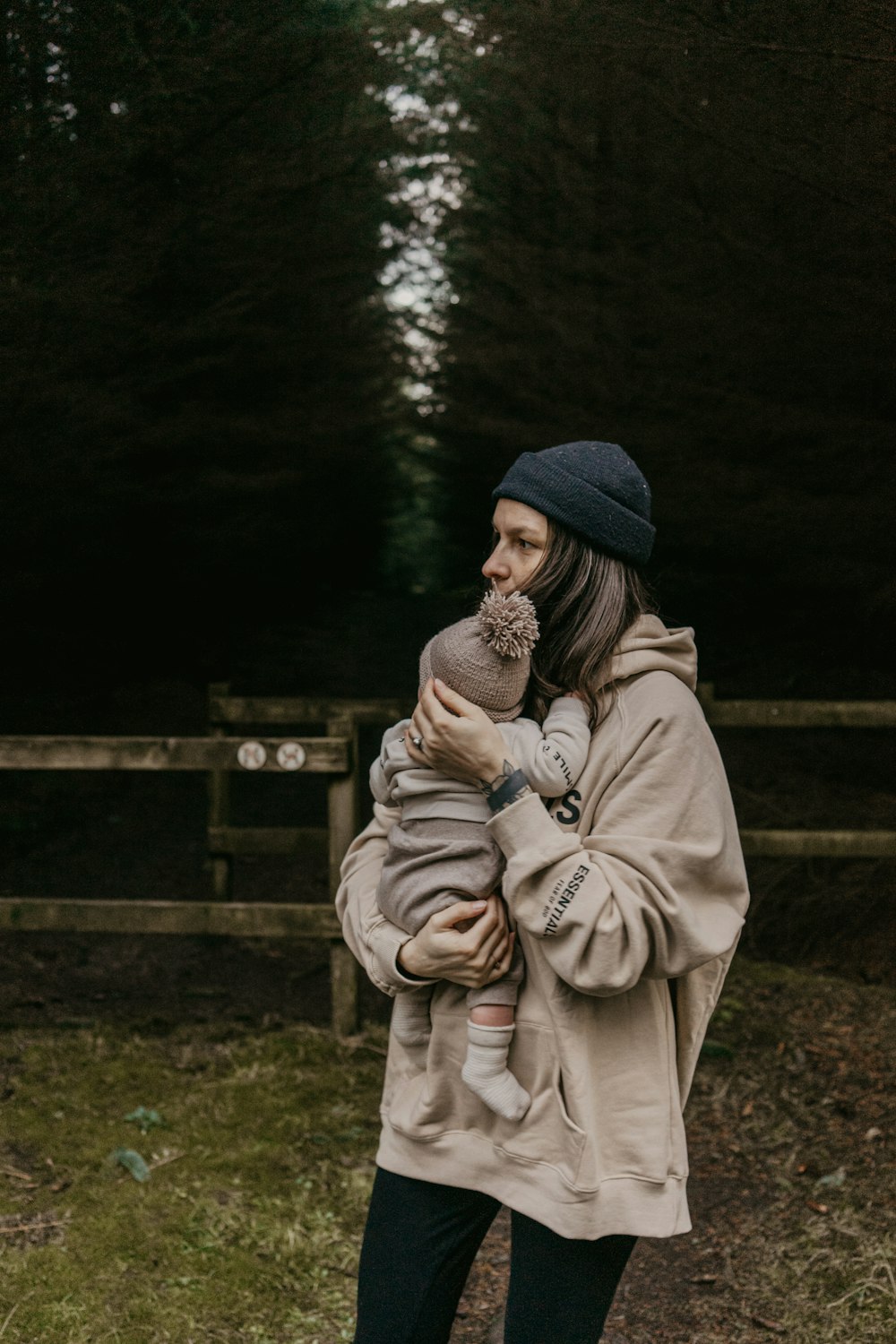 a woman holding a baby in her arms