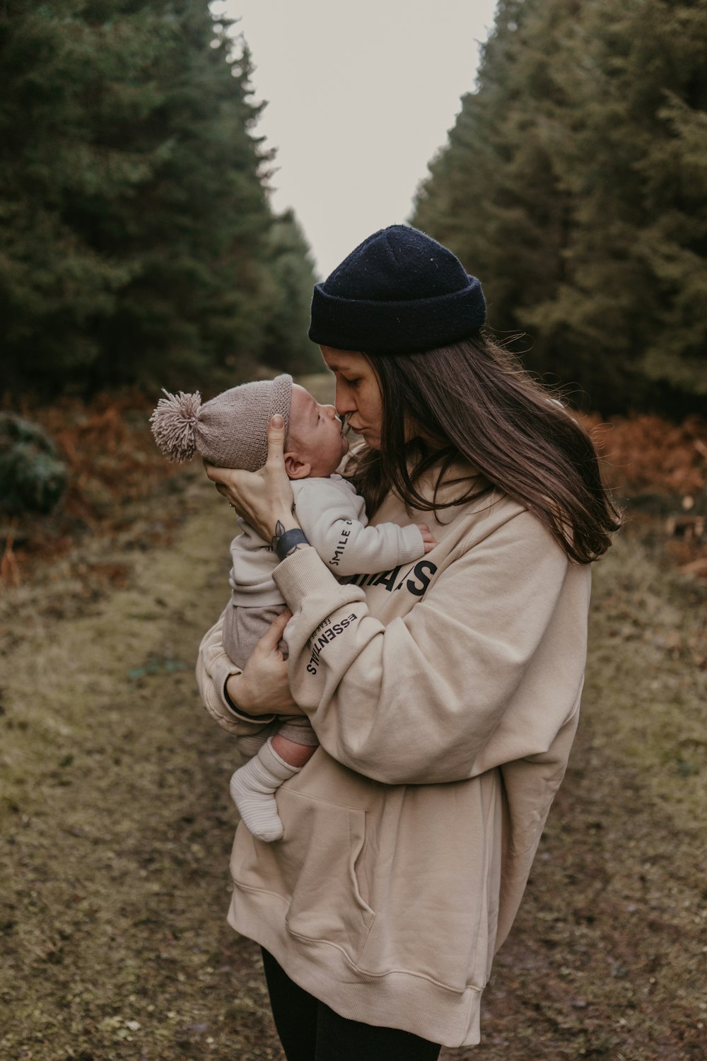 a woman holding a baby in her arms