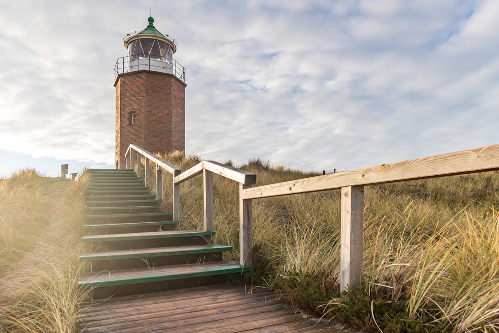 a set of stairs leading up to a lighthouse