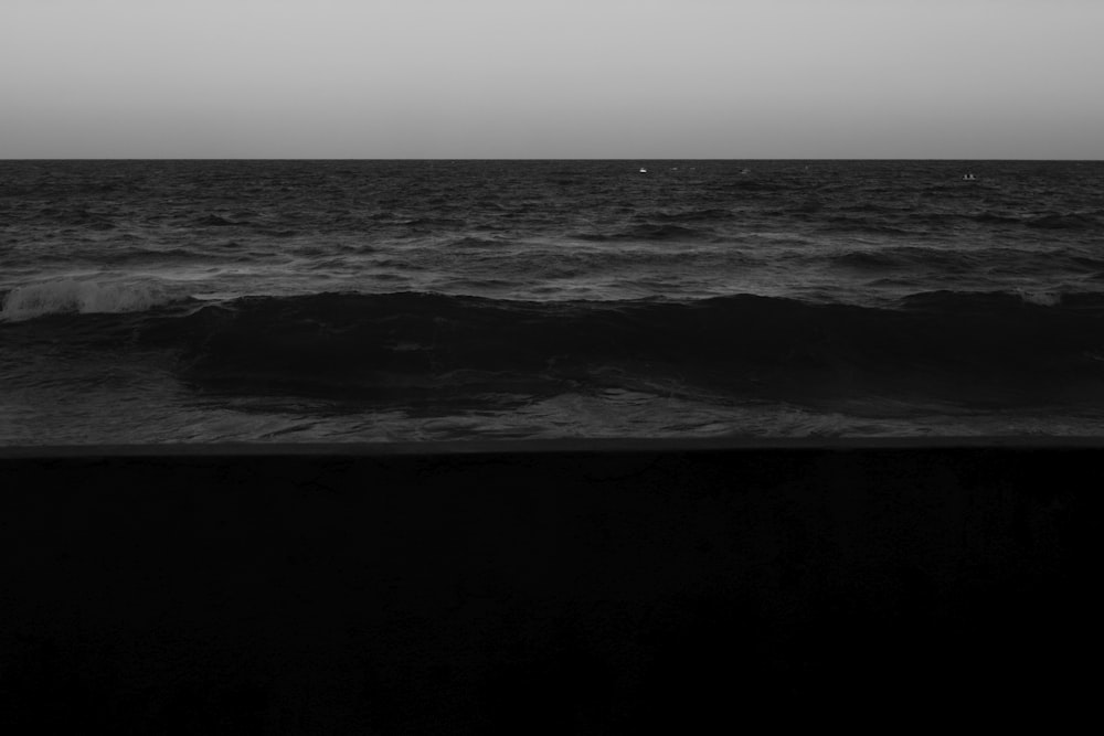 a black and white photo of the ocean