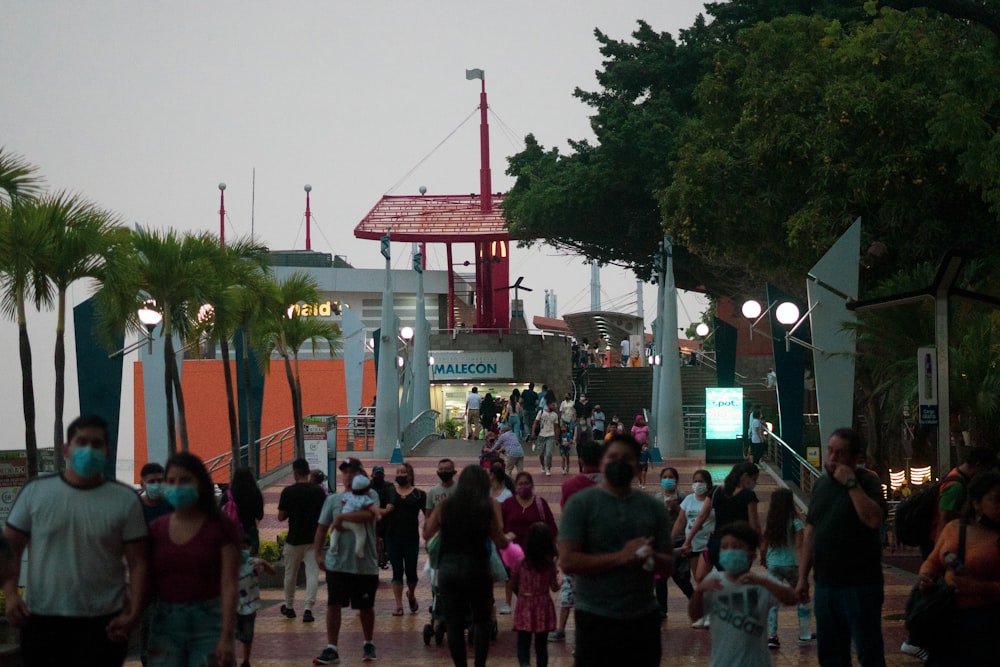 a group of people walking down a street